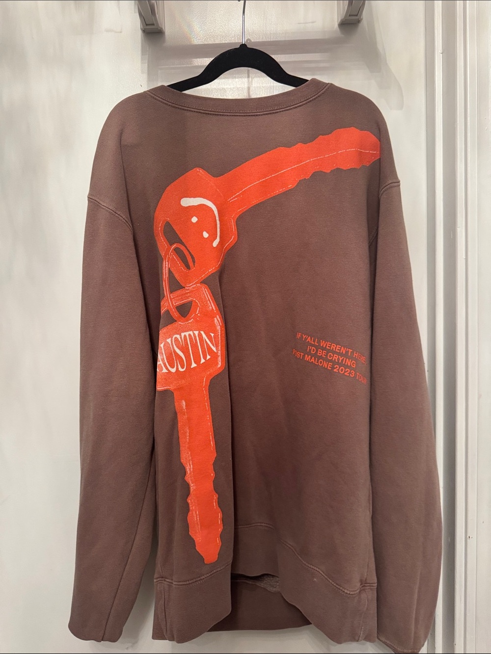 Brown Crewneck Sweatshirt with Orange Key Graphic
